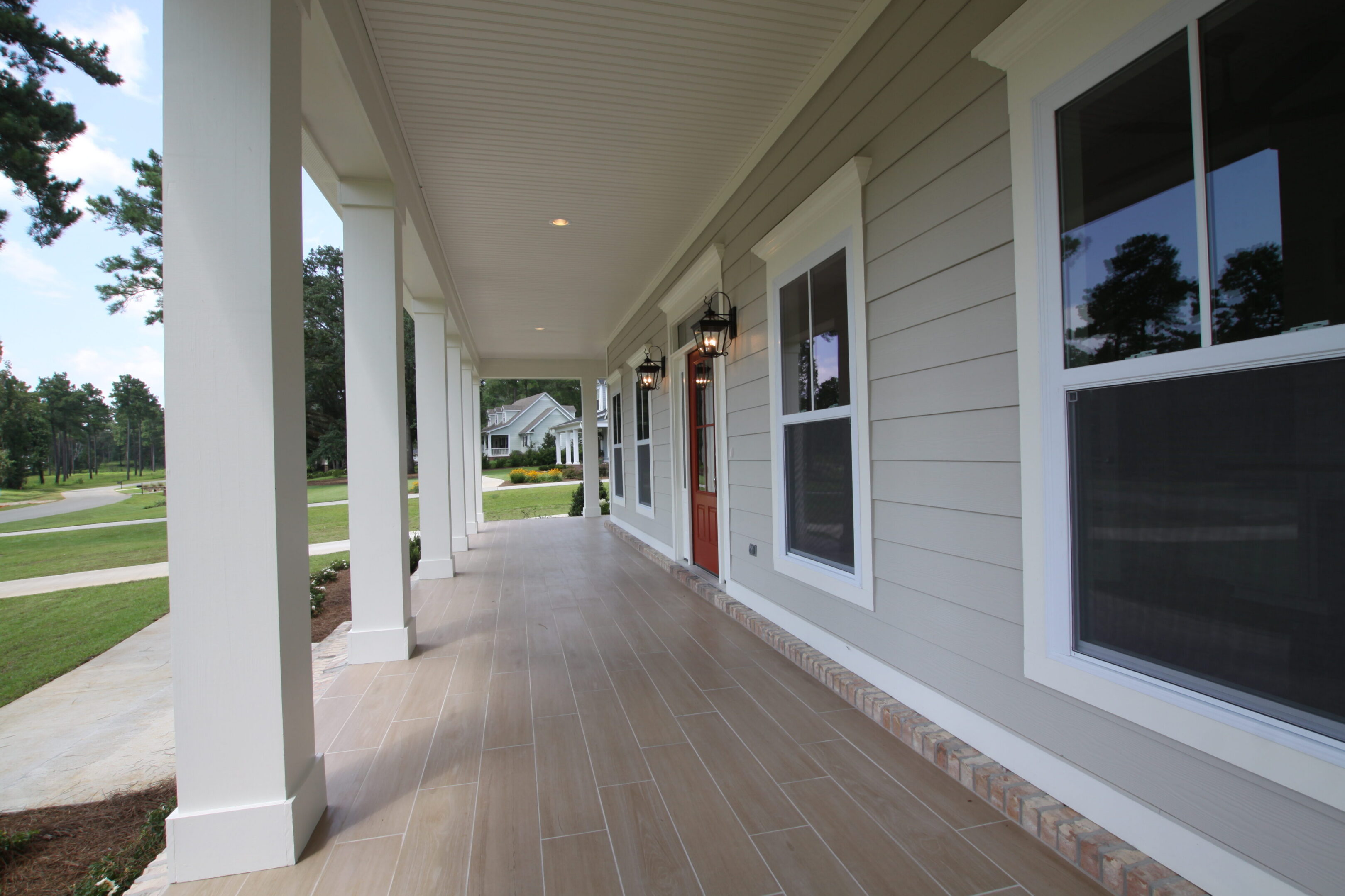 Modern porch with red door