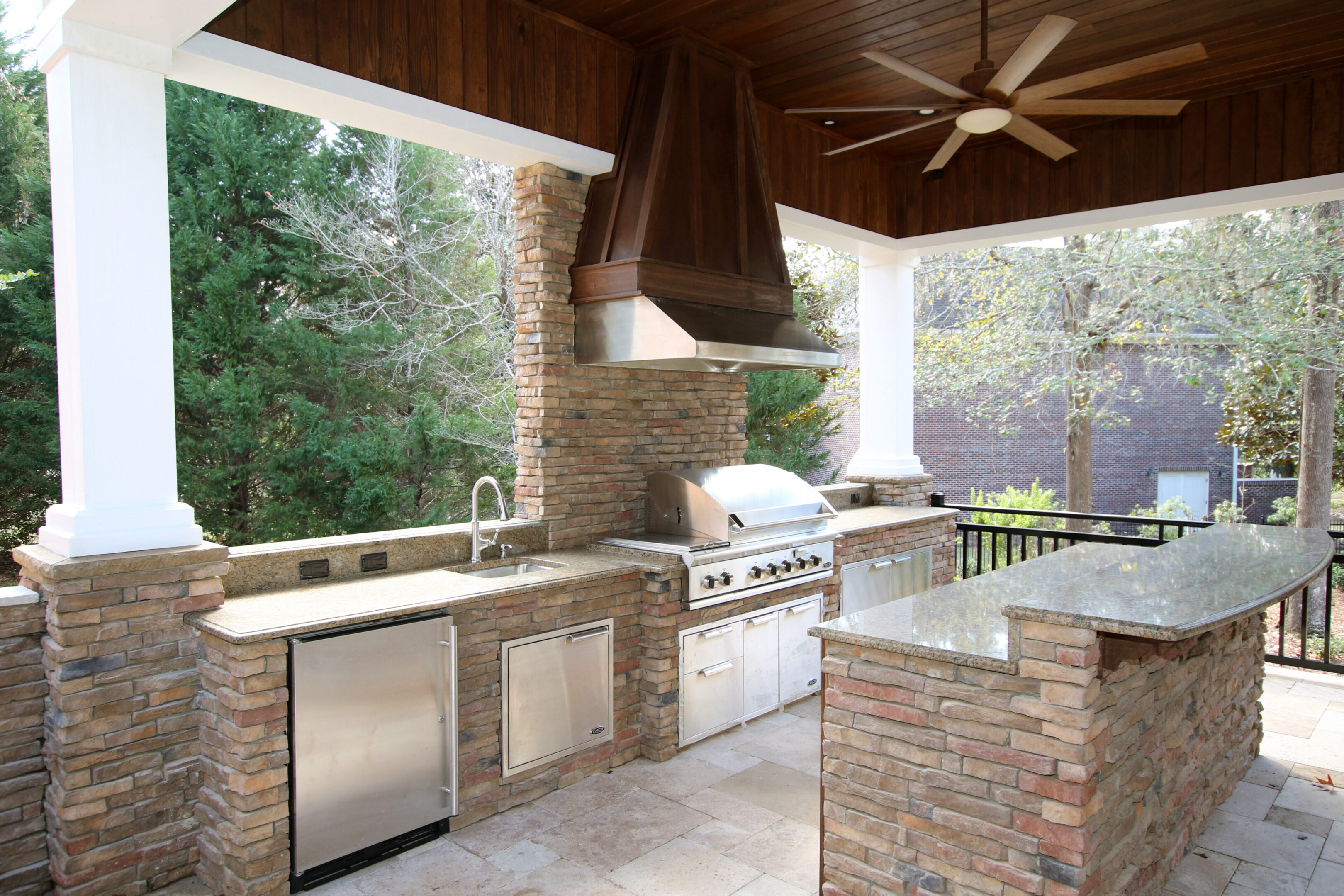 Modern barbecue area under wooden ceiling