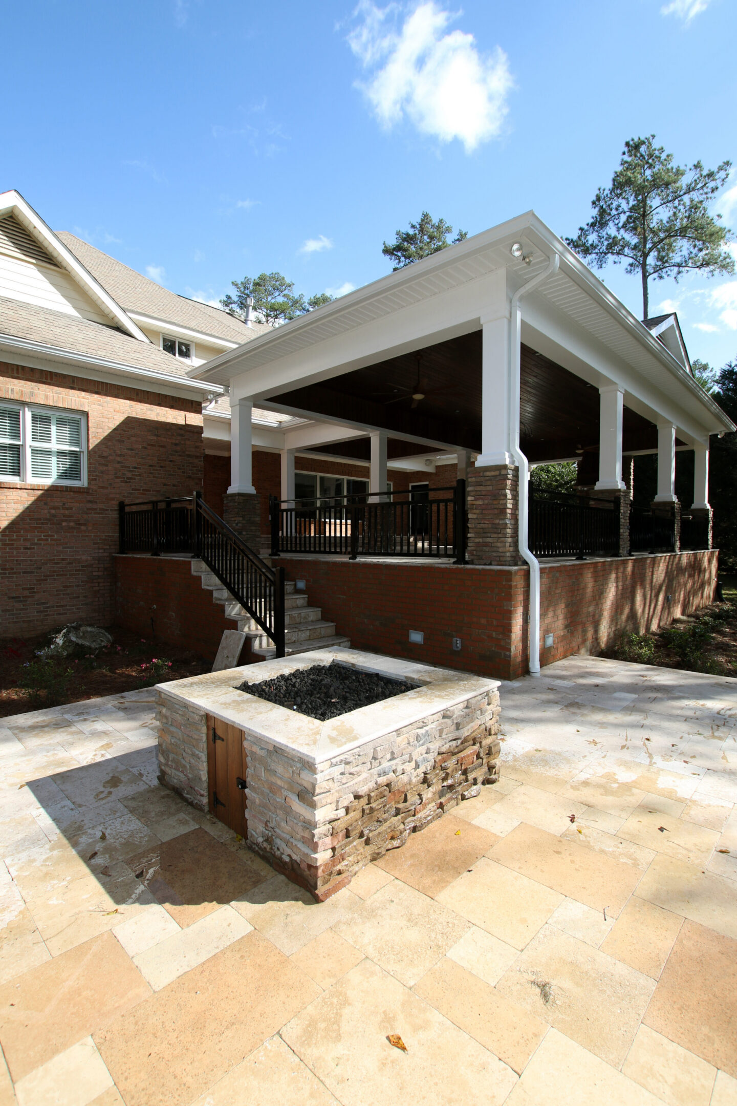 Covered patio with brick fire pit