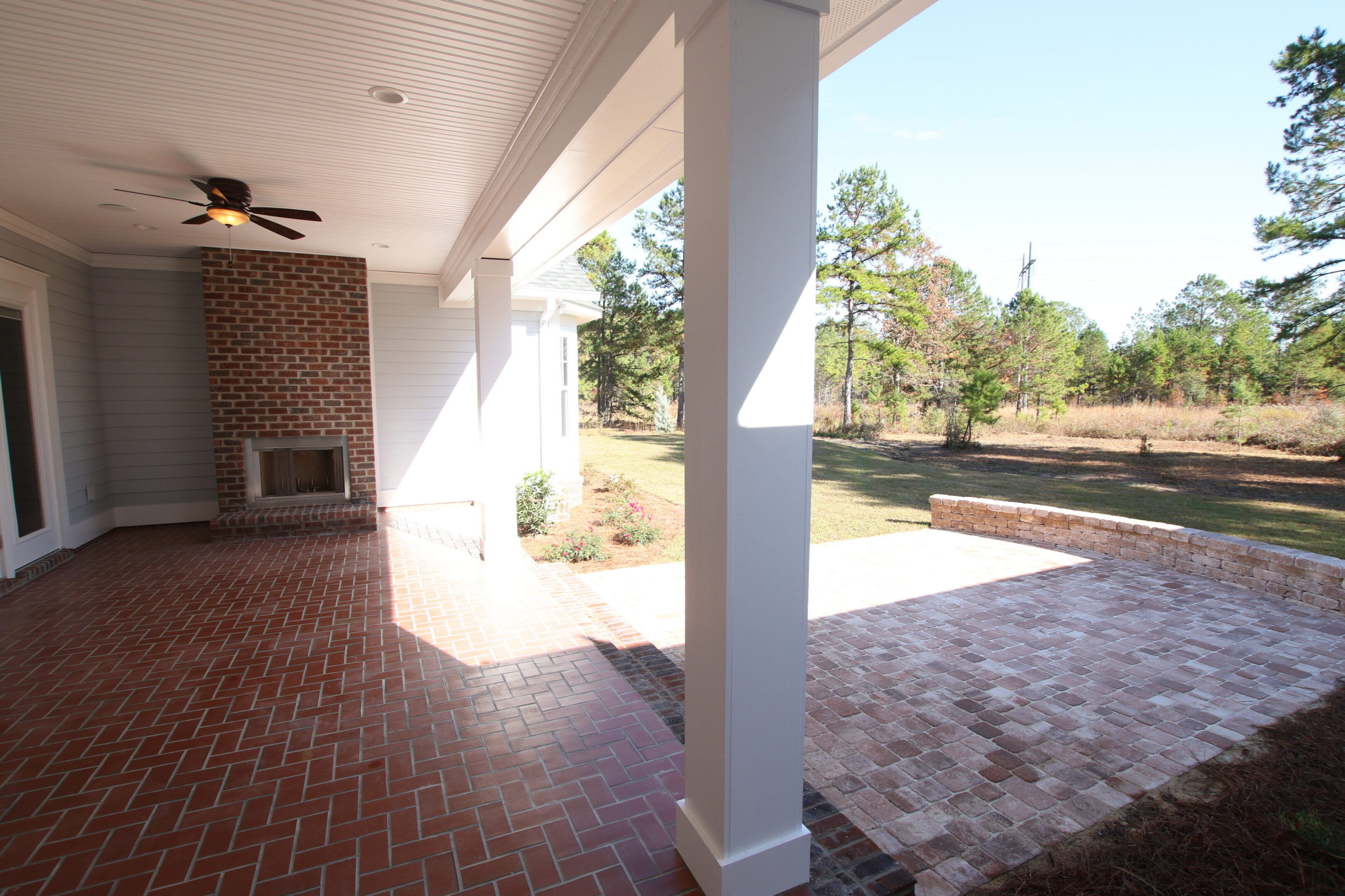 Covered patio with brick fireplace