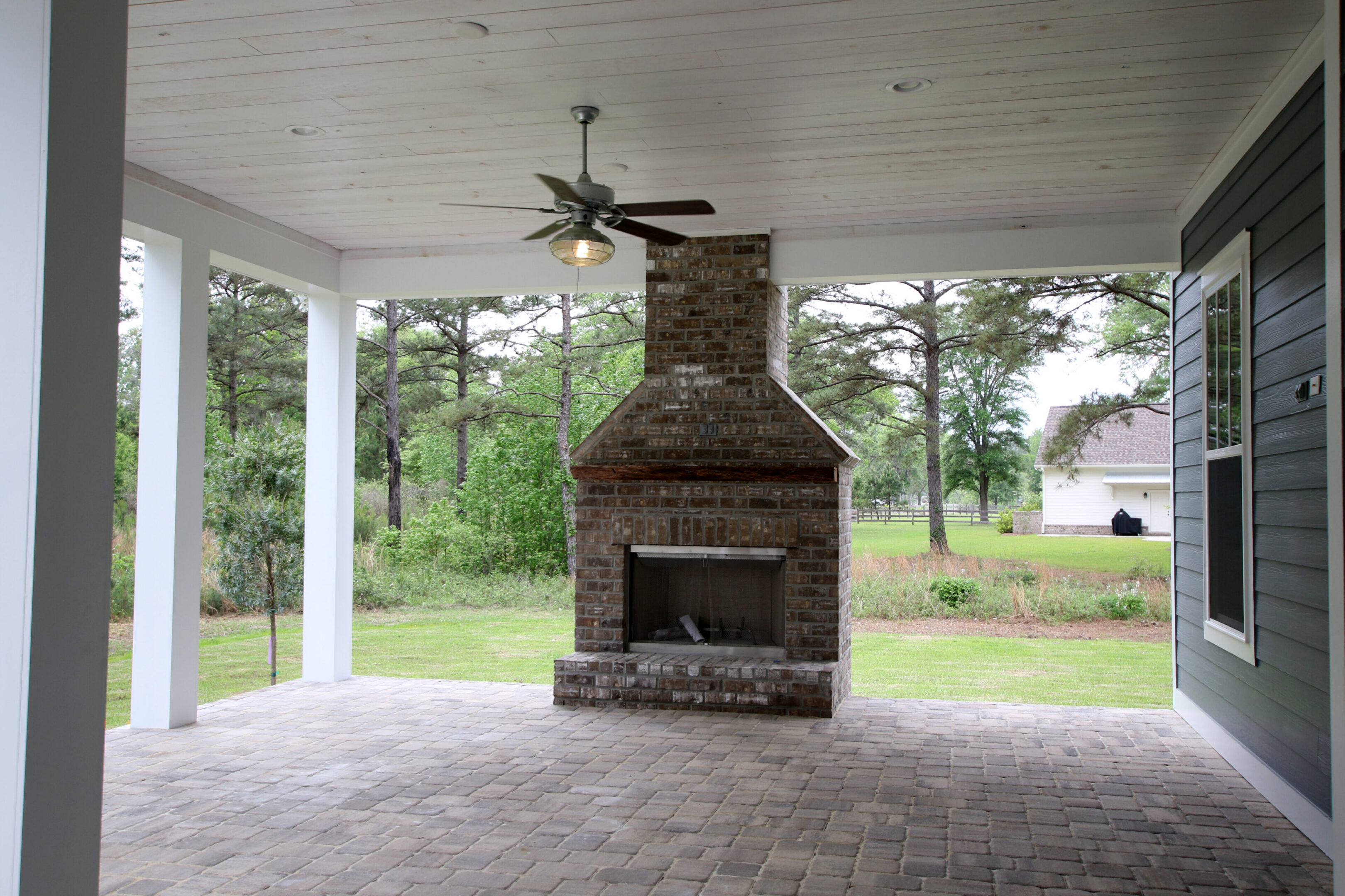 Covered patio with brick fireplace