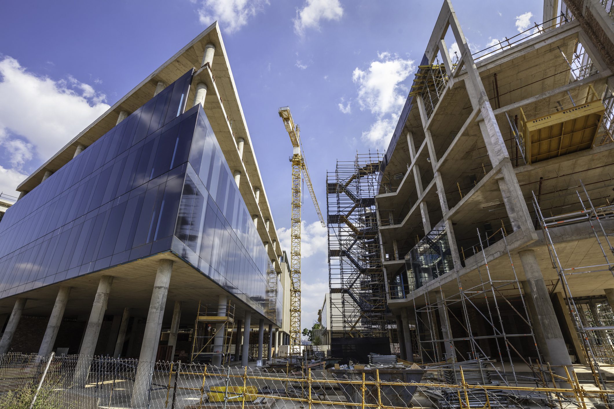Construction site with scaffolding and cranes
