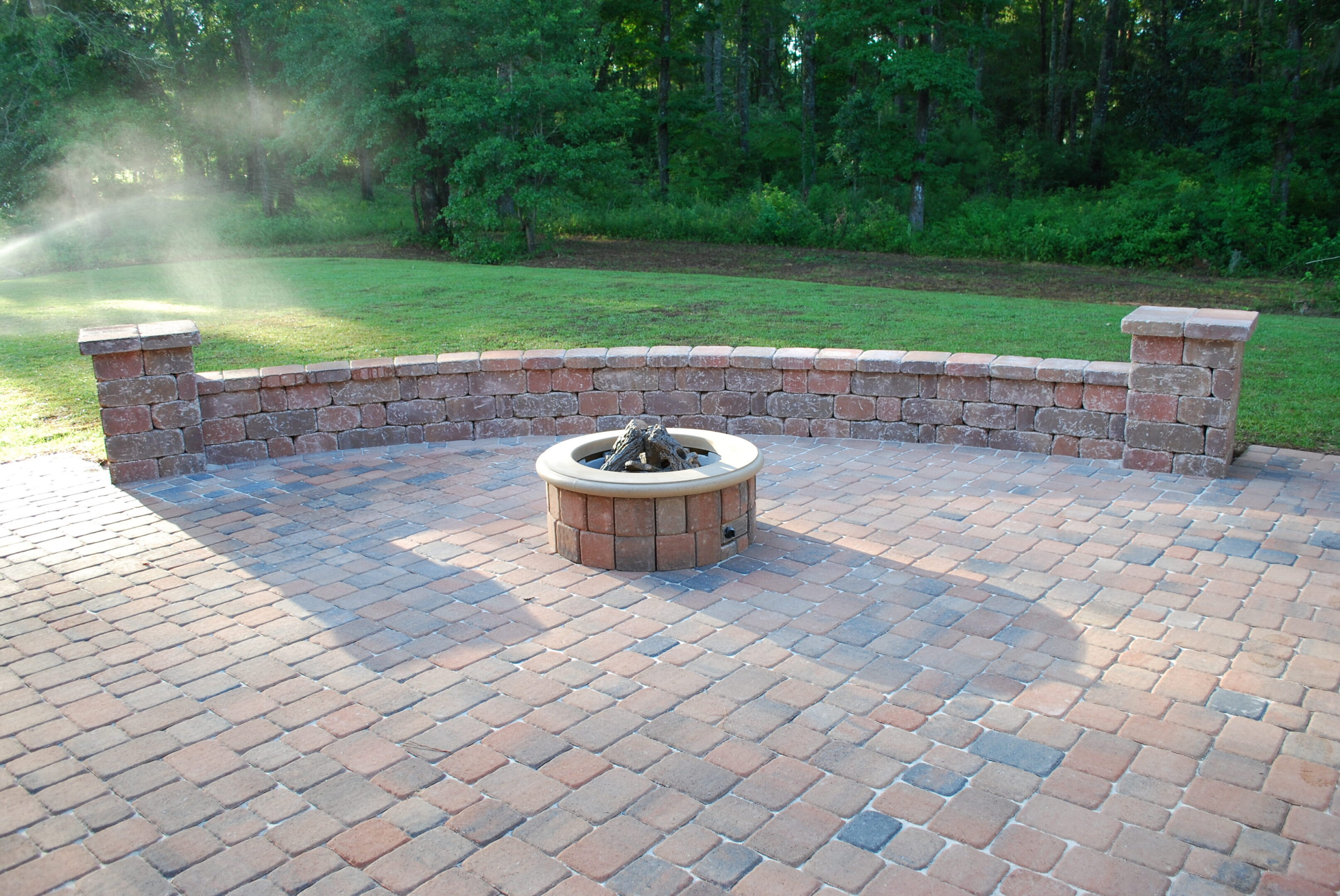 Backyard fire pit with brick seating