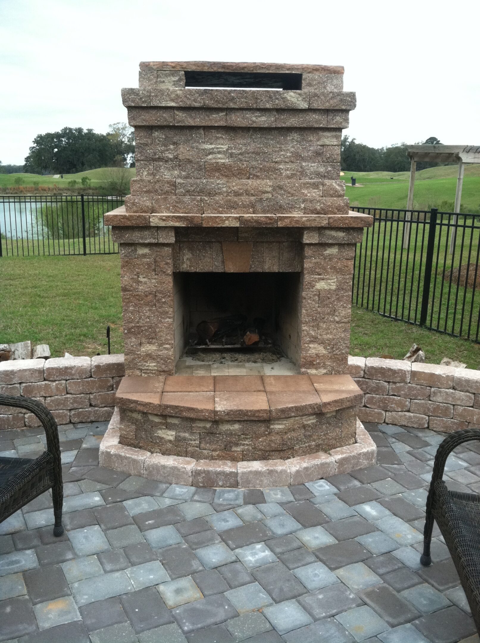 Patio with stone fireplace and seating