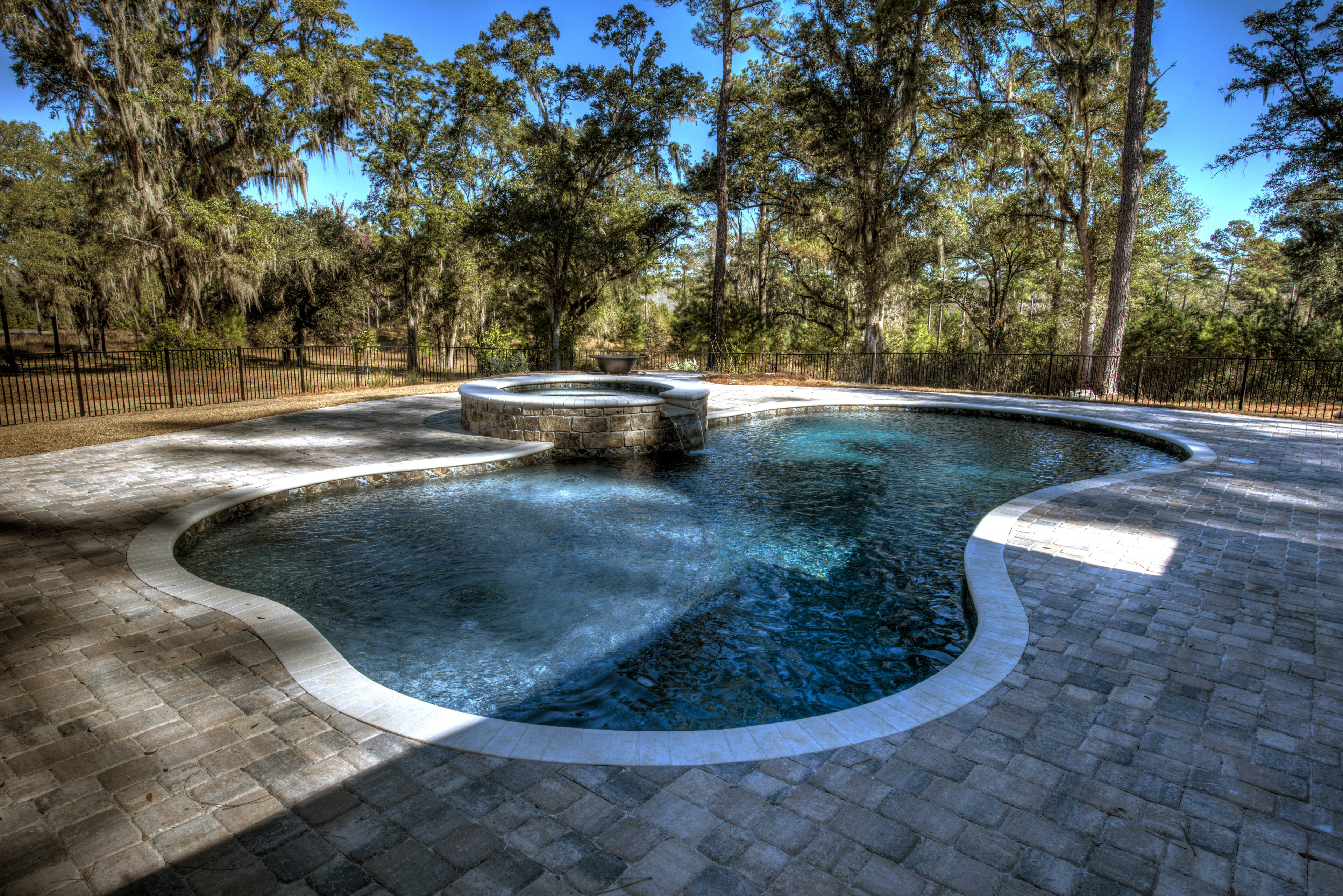 Outdoor pool with trees in background
