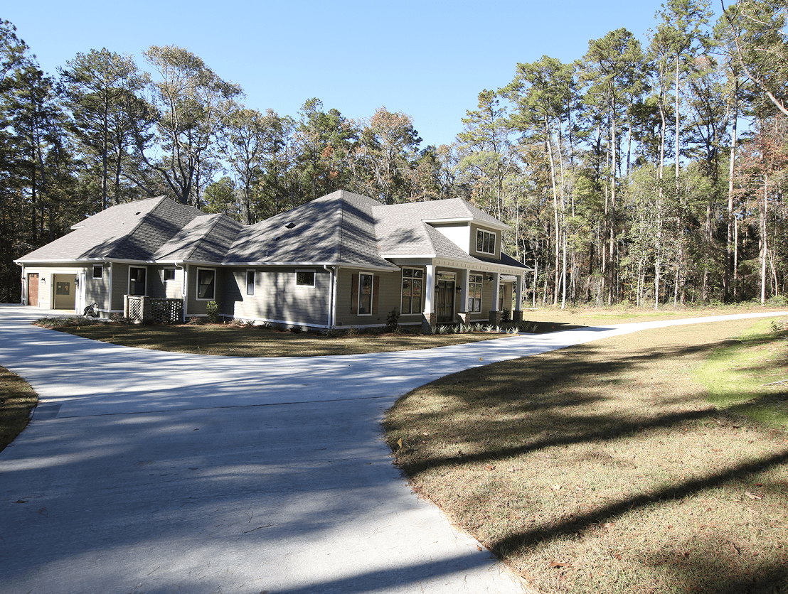 Suburban home surrounded by trees