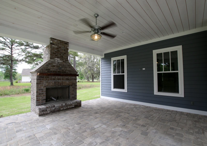 Spacious patio beside grassy yard